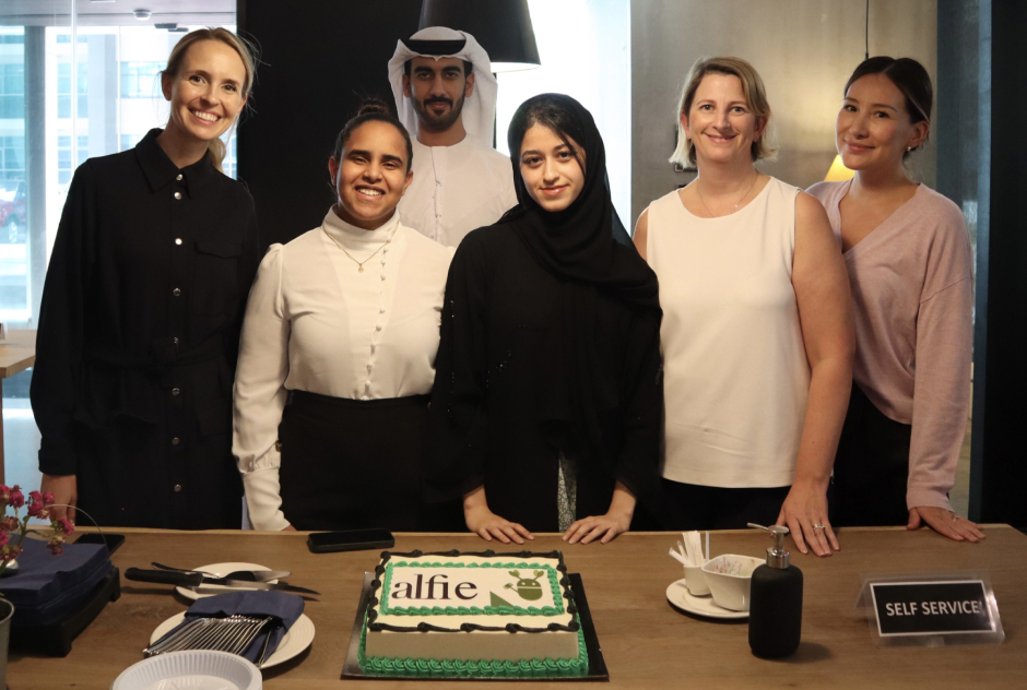 The team with their celebratory cake on launch day!